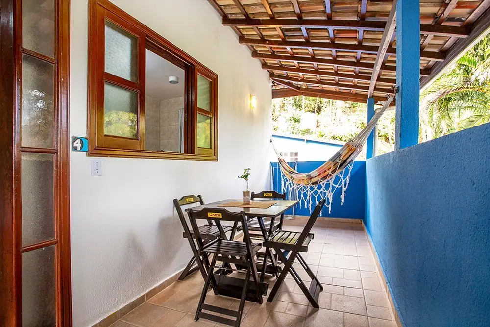 Apartment balcony with a hammock and a table
