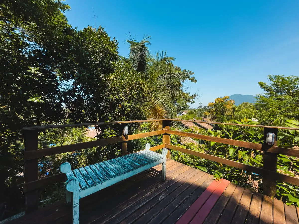 The inn's wooden porch overlooking the forest and mountains
