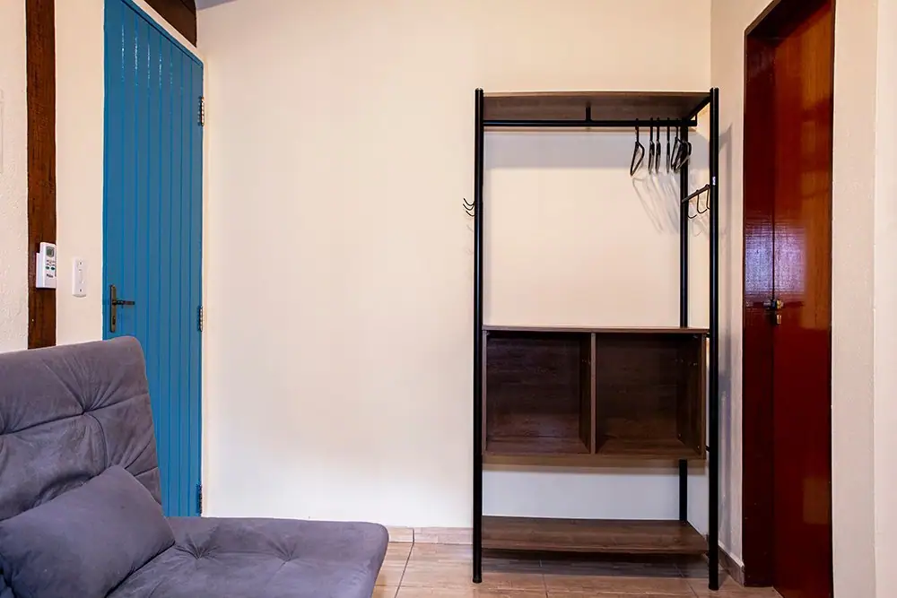 Wardrobe and sofa in the Deluxe Suite