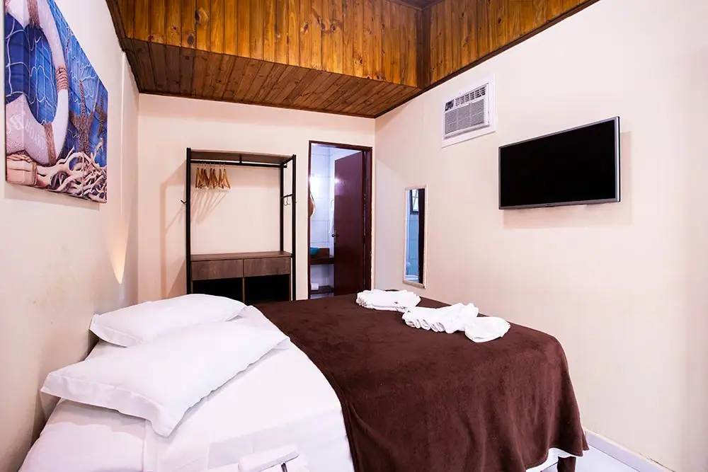 Double bed in the Economy Suite, with air conditioning and TV